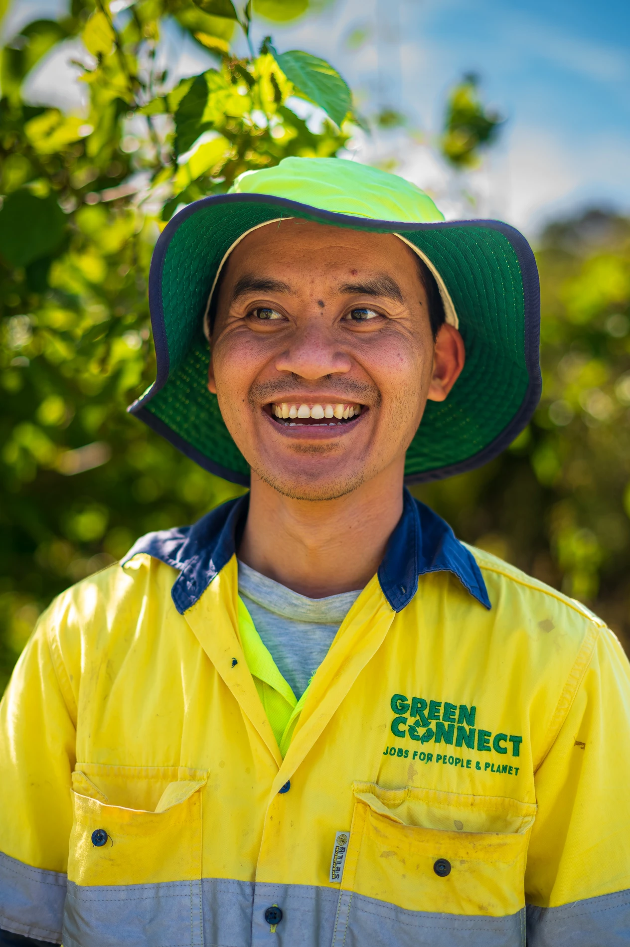 Post Green Connect Cover Image Volunteer Hat Looking Off Camera