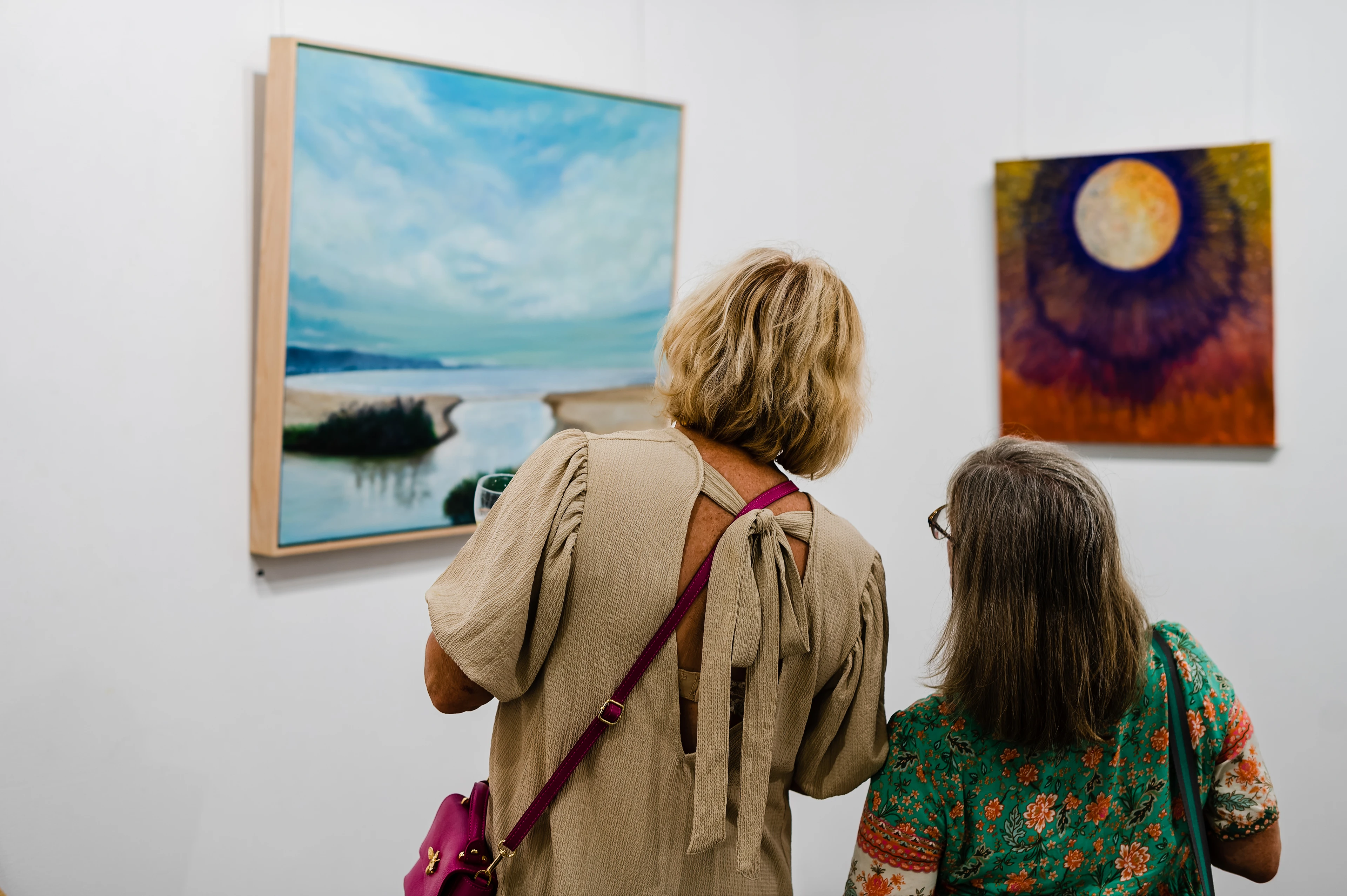 From Hobbyist To Professional: A Photographer'S Journey To Keeping The Fun Alive 1 Women Viewing Landscape And Abstract Paintings In An Art Gallery Setting.